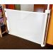 Smart Retract Retract-A-Gate Retractable Baby & Pet Safety Gate in white color used at a doorway