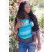 Black lady front carries her baby in a Tula Standard Baby Carrier Laguna Sky