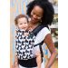 Lady carries her baby in a Tula Standard Twiggy Baby Carrier