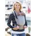 Mother carries newborn in a Tula Free to Grow FTG Baby Carrier at the pier