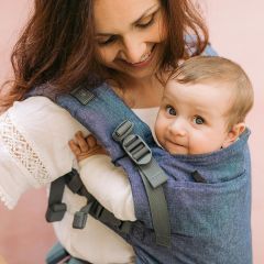 Baby smiling in a Boba X Grey Carrier