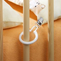 Reer Blanket Holder helps to prevent blanket slipping in the baby cot