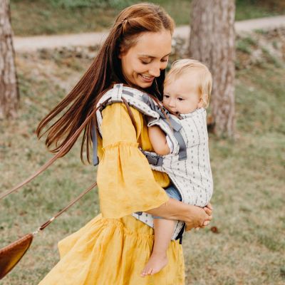 Boba X Baby & Toddler Carrier Yucca used by lady to carry her child in front carry position