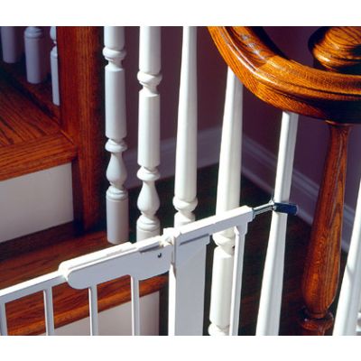 Kidco Y-Spindle used with Kidco Gateway pressure gate at the bottom of stairs with baluster