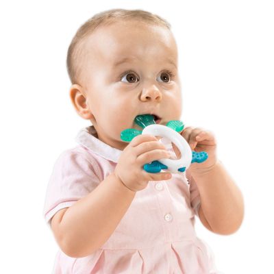 Teething baby biting on a Reer Cool & Play Cooling Teether with Rattle 