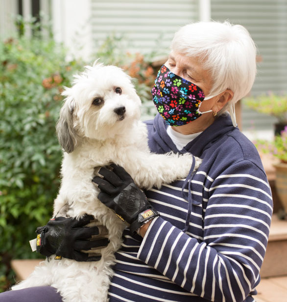 Old lady with her dog wearing a BreatheHealthy Paws 2 Face Mask